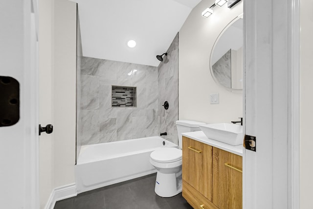 full bath with toilet, vanity, tile patterned floors, and shower / tub combination