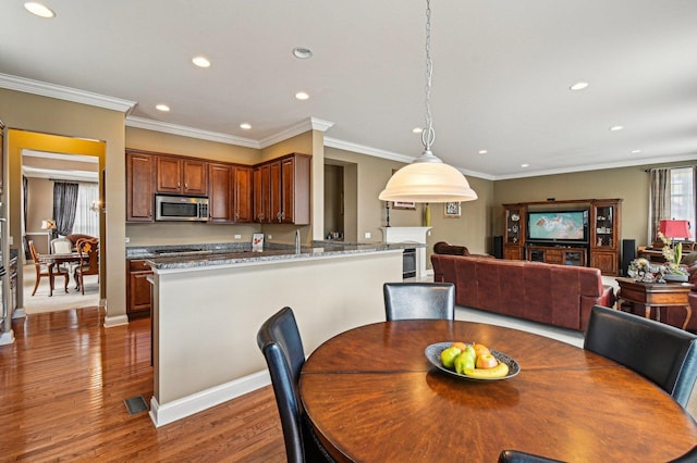 1037 Moray Dr, Inverness, IL 60010 - dining area featuring dark wood-style flooring, crown molding, and recessed lighting