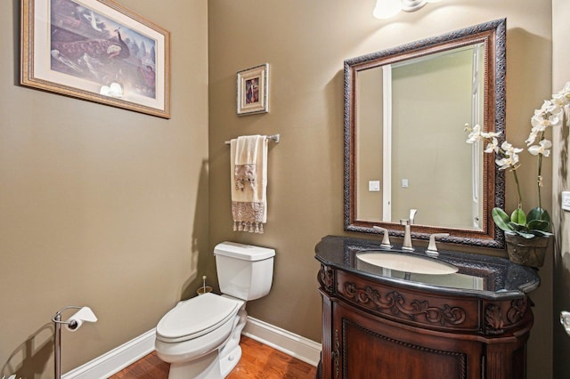 1037 Moray Dr, Inverness, IL 60010 - bathroom featuring baseboards, toilet, vanity, and wood finished floors