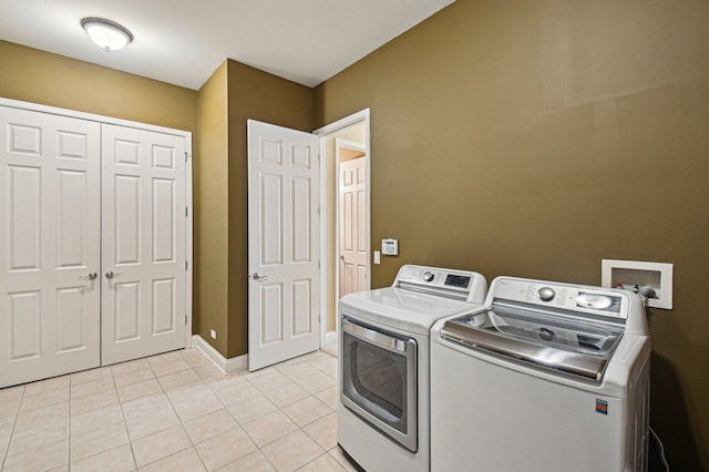 1037 Moray Dr, Inverness, IL 60010 - clothes washing area featuring baseboards, washing machine and clothes dryer, laundry area, and light tile patterned floors