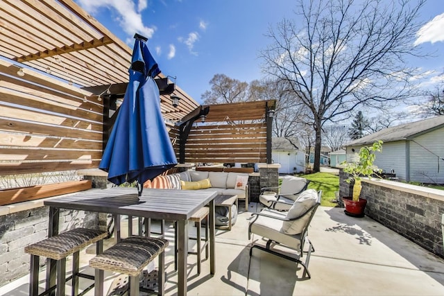 view of patio / terrace with a pergola and outdoor lounge area