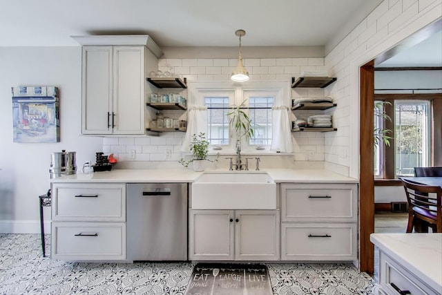 kitchen with open shelves, decorative backsplash, dishwasher, and a sink