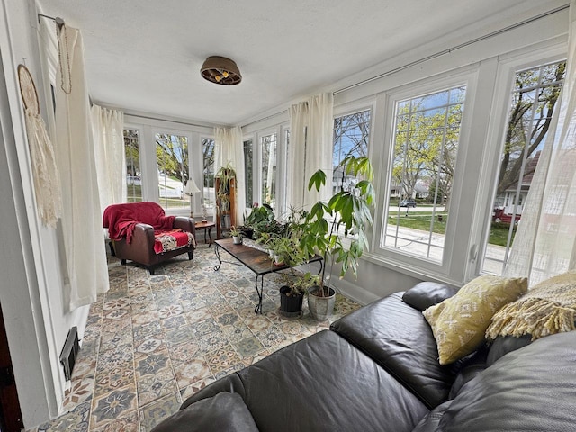 sunroom featuring a wealth of natural light and visible vents