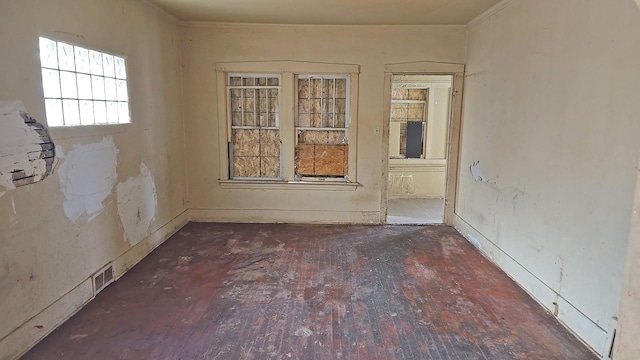 15231 Ashland Ave, Harvey, IL 60426 - spare room featuring visible vents and crown molding