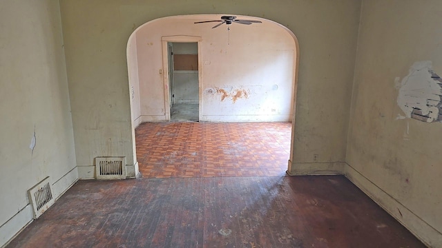 15231 Ashland Ave, Harvey, IL 60426 - empty room featuring visible vents, arched walkways, and parquet floors
