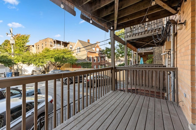 wooden terrace with a residential view