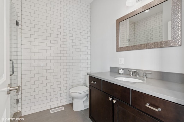 29 N Morgan St Unit Ph, Chicago, IL 60607 - bathroom with vanity, toilet, a shower stall, and tile patterned flooring