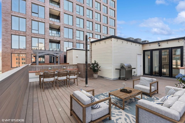 29 N Morgan St Unit Ph, Chicago, IL 60607 - wooden terrace with an outdoor hangout area, a grill, and outdoor dining area