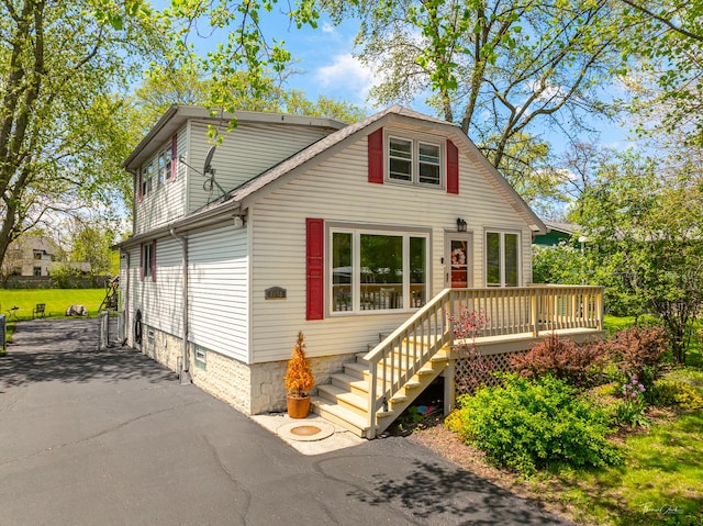 view of front of property featuring a wooden deck