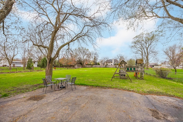 view of yard with a playground and a patio