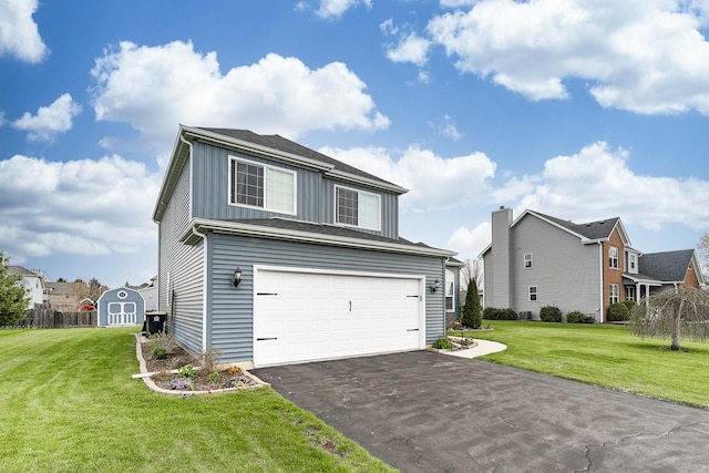 traditional home featuring a front lawn, board and batten siding, an attached garage, driveway, and a storage unit