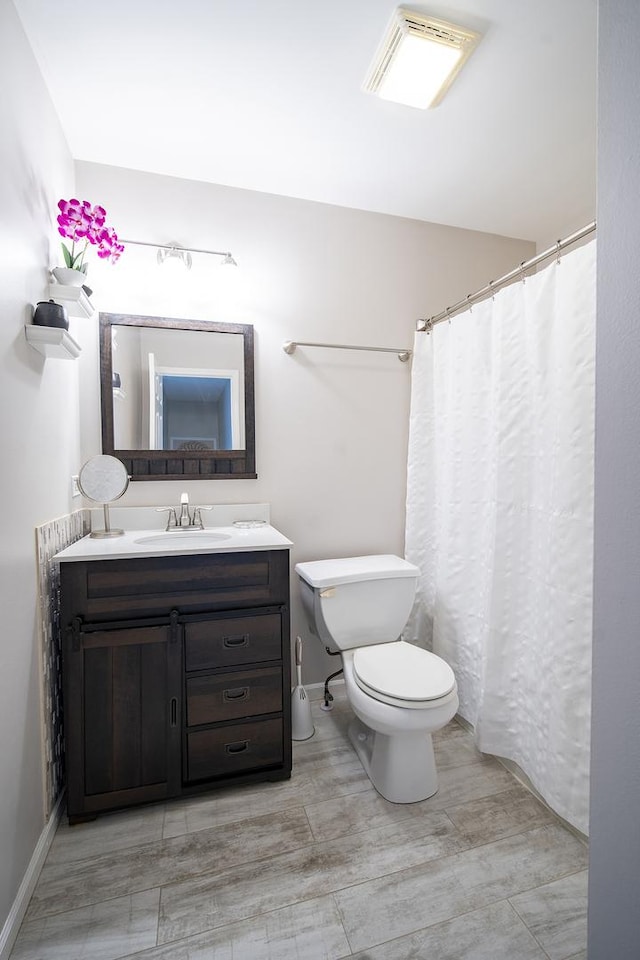 full bath featuring visible vents, vanity, and toilet