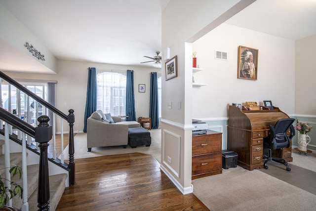 office featuring wood finished floors, visible vents, and ceiling fan