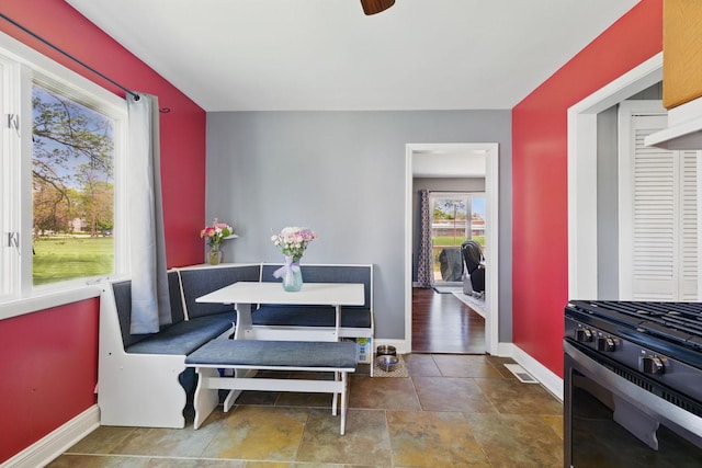 dining space featuring baseboards