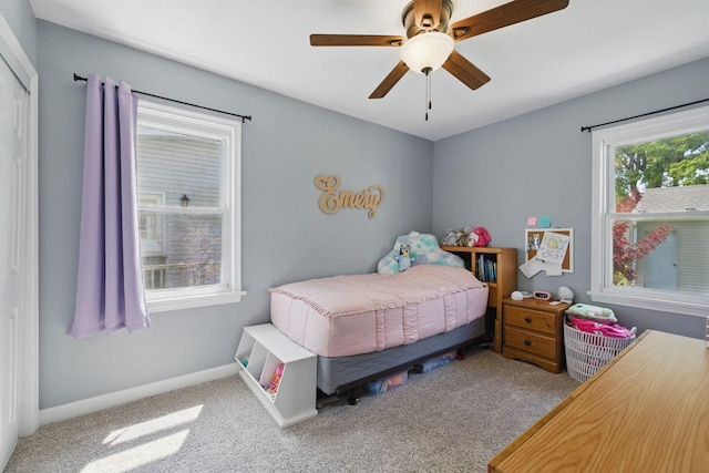 bedroom with carpet floors, a ceiling fan, and baseboards