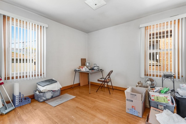 miscellaneous room with baseboards and wood finished floors