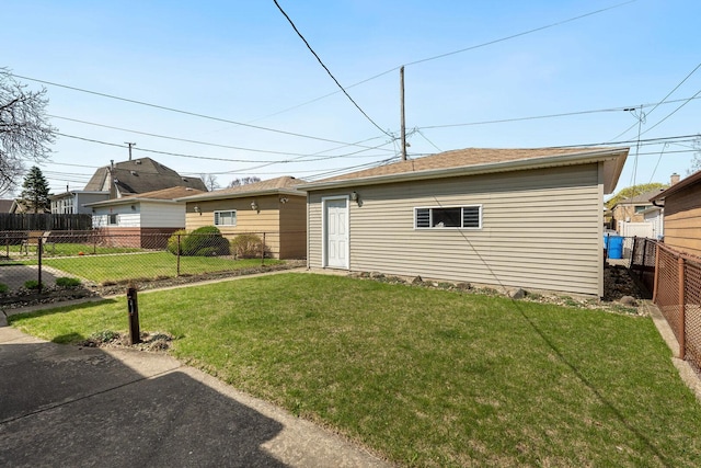 view of front of house featuring a front yard and a fenced backyard