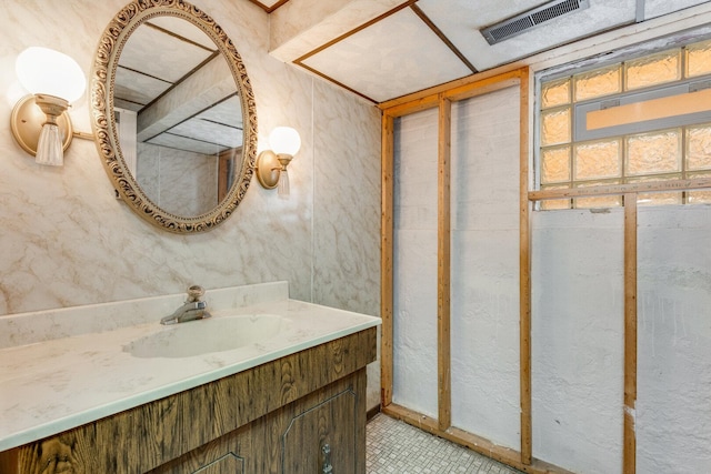 bathroom with vanity and visible vents