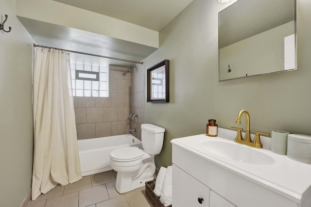 full bathroom featuring tile patterned floors, toilet, vanity, baseboards, and shower / bath combo