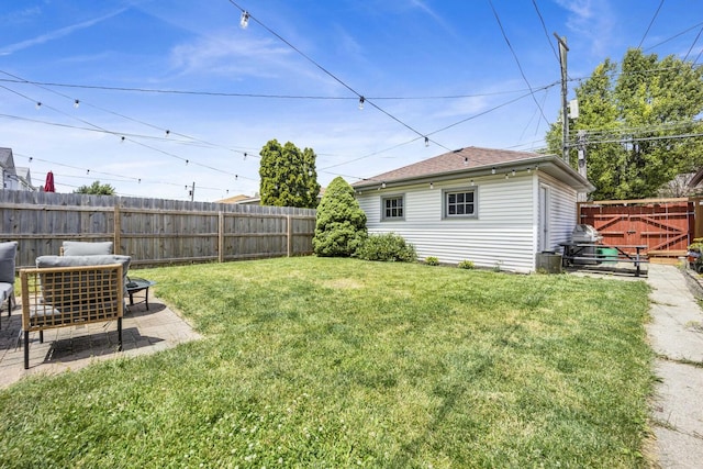 view of yard featuring a patio and a fenced backyard