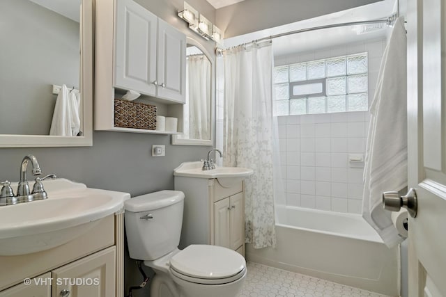full bath featuring shower / bath combo with shower curtain, toilet, tile patterned flooring, and vanity
