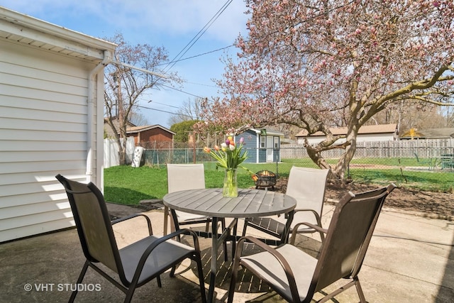 view of patio featuring outdoor dining space and a fenced backyard