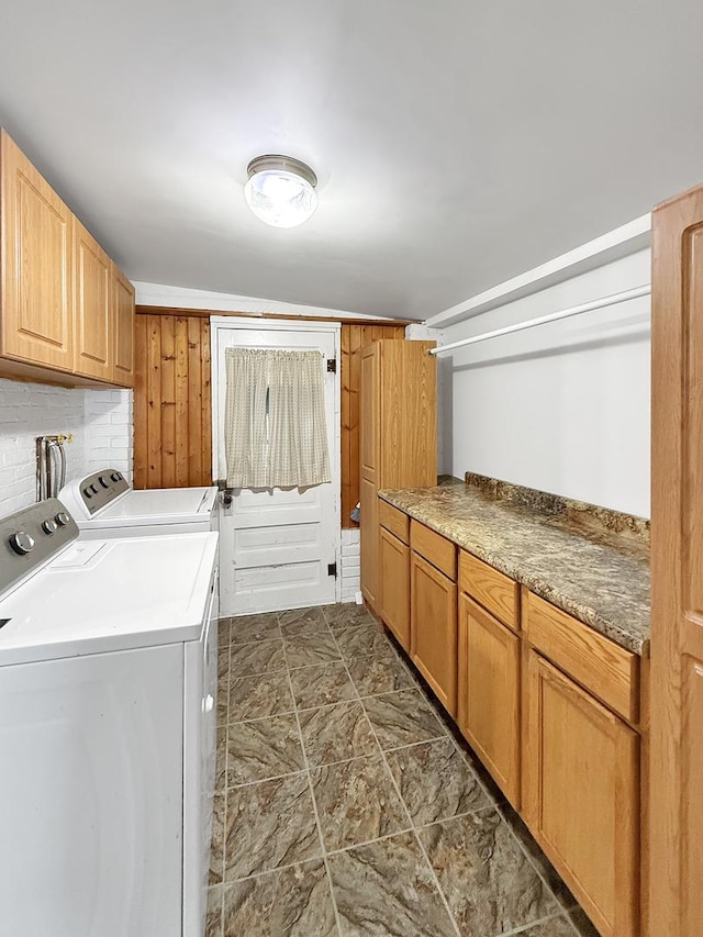 laundry room with cabinet space and washing machine and dryer