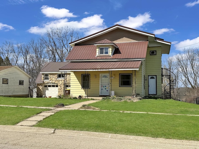 view of front of property with stone siding, a porch, a front lawn, and metal roof