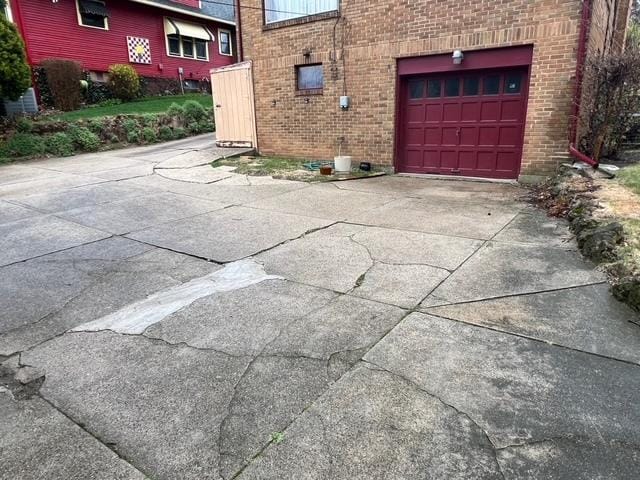 garage featuring driveway