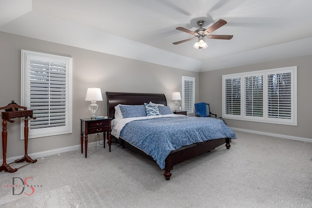 bedroom featuring baseboards, visible vents, and light colored carpet