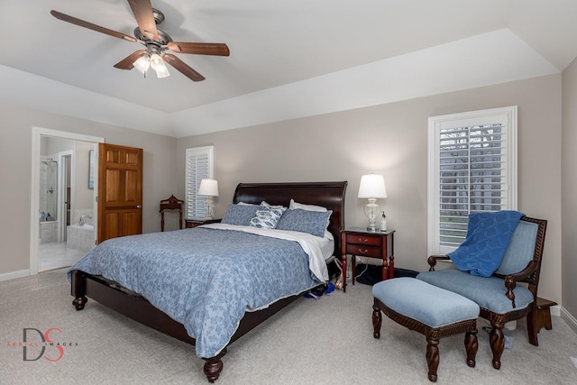 bedroom featuring ensuite bathroom, baseboards, carpet floors, and ceiling fan