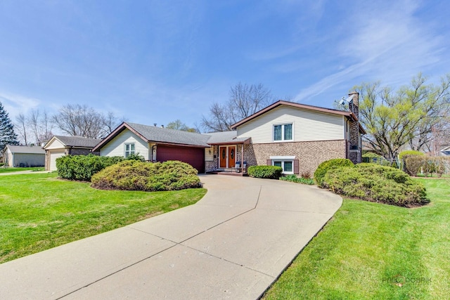 1338 E Best Dr, Arlington Heights, IL 60004 - tri-level home with a chimney, brick siding, a front lawn, concrete driveway, and an attached garage