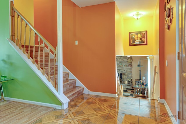 1338 E Best Dr, Arlington Heights, IL 60004 - staircase with a stone fireplace and baseboards
