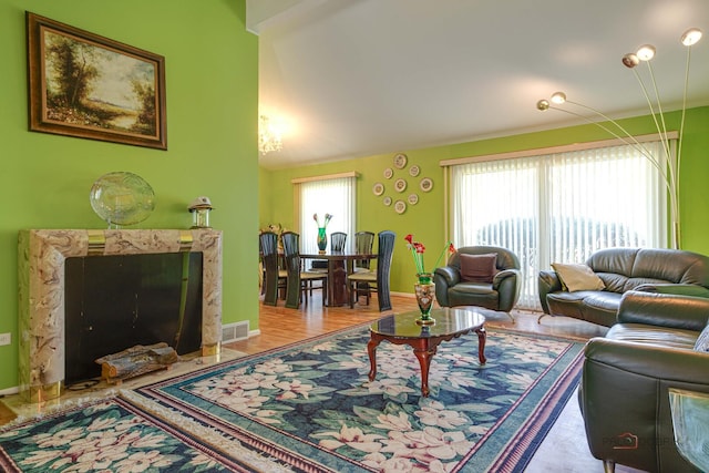 1338 E Best Dr, Arlington Heights, IL 60004 - living area with baseboards, visible vents, wood finished floors, and vaulted ceiling