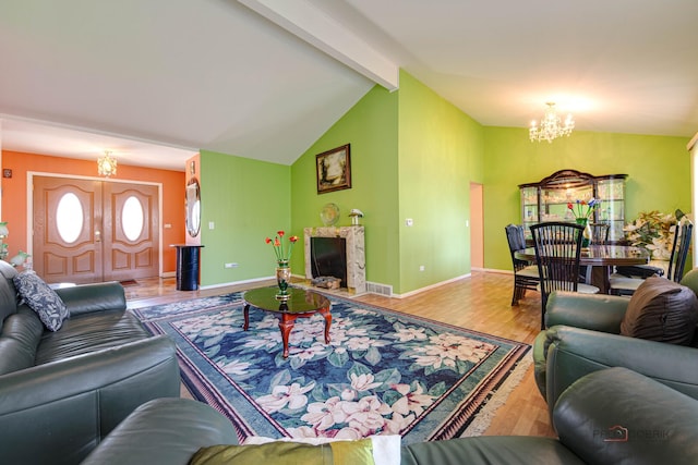 1338 E Best Dr, Arlington Heights, IL 60004 - living area featuring an inviting chandelier, lofted ceiling with beams, visible vents, a high end fireplace, and wood finished floors