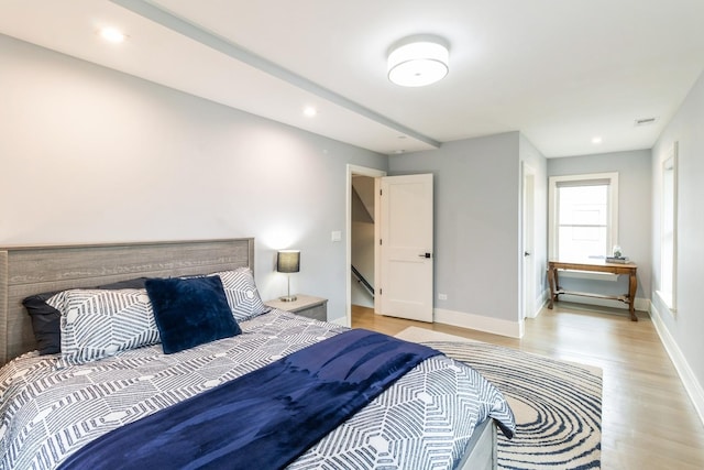 bedroom featuring light wood-style flooring, baseboards, visible vents, and recessed lighting