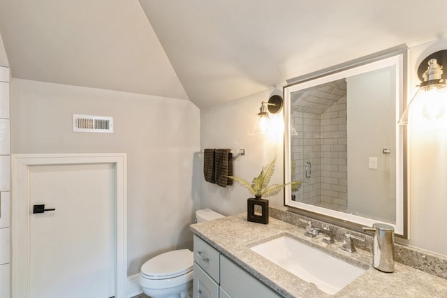bathroom with toilet, a stall shower, visible vents, lofted ceiling, and vanity