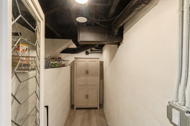below grade area featuring wood finished floors