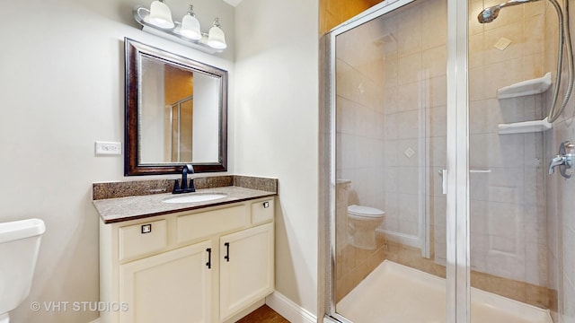 1544 N Wolf Rd, Berkeley, IL 60163 - bathroom with toilet, a stall shower, and vanity