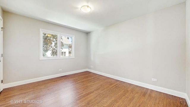 1544 N Wolf Rd, Berkeley, IL 60163 - unfurnished room featuring wood finished floors and baseboards