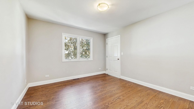 1544 N Wolf Rd, Berkeley, IL 60163 - empty room with wood finished floors and baseboards