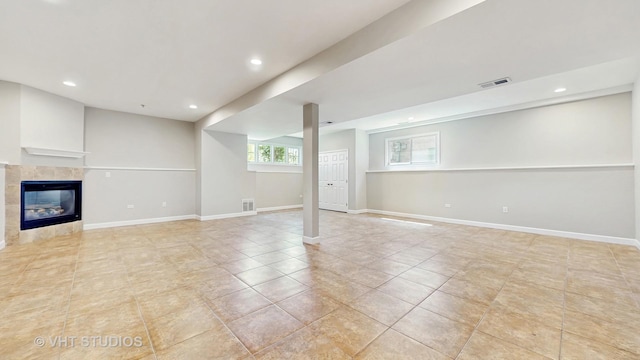 1544 N Wolf Rd, Berkeley, IL 60163 - basement with recessed lighting, a tile fireplace, light tile patterned flooring, and baseboards