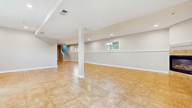 1544 N Wolf Rd, Berkeley, IL 60163 - basement featuring stairs, a tiled fireplace, recessed lighting, and baseboards