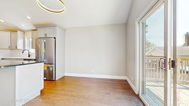 1544 N Wolf Rd, Berkeley, IL 60163 - kitchen featuring freestanding refrigerator, plenty of natural light, light wood-type flooring, and recessed lighting