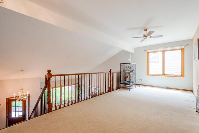 additional living space featuring carpet floors, visible vents, vaulted ceiling with beams, and ceiling fan with notable chandelier