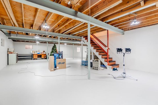 unfinished basement featuring stairway