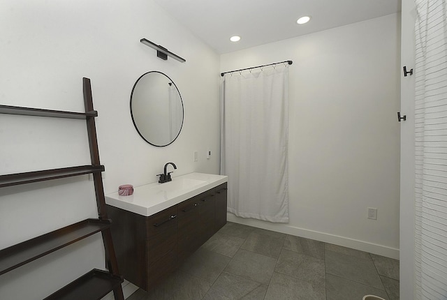 112 W Porter St, Oglesby, IL 61348 - bathroom featuring vanity, tile patterned flooring, baseboards, recessed lighting, and a shower with curtain