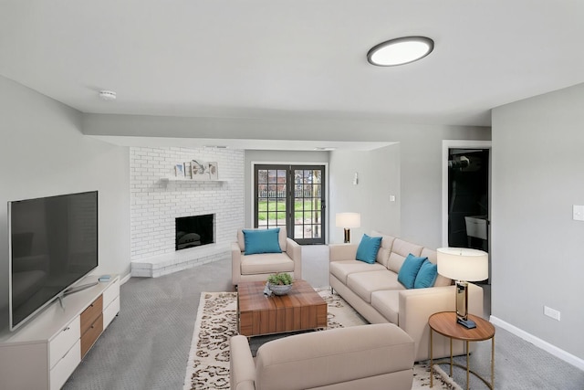 living room featuring a brick fireplace, baseboards, and light carpet