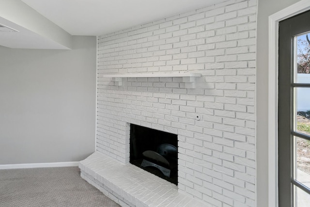 room details featuring baseboards, a fireplace, and carpet flooring