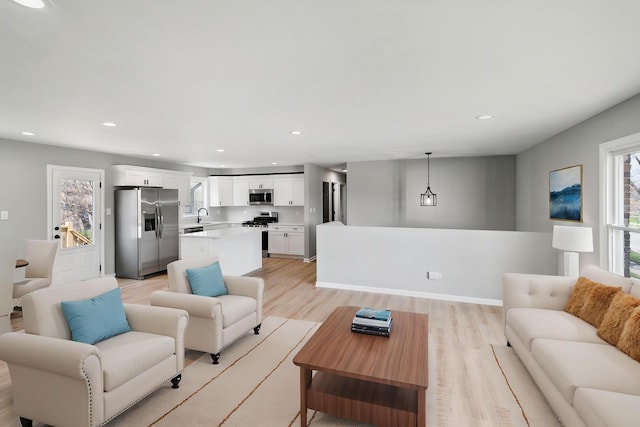 living room featuring recessed lighting and light wood finished floors